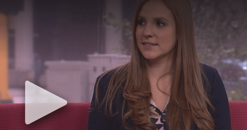 Erin Pash, Chief Executive Officer and Founder of Ellie Mental Health, on the Dr. Phil Show, dressed in a pink and blue top and a dark blue business jacket.