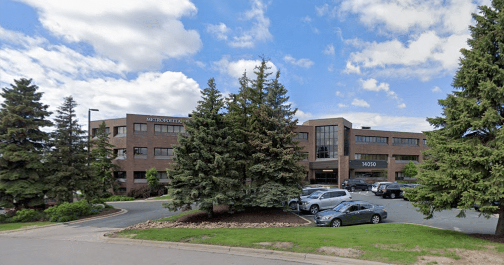 An exterior image of a commercial office building in Burnsville, Minnesota where an Ellie Mental Health Therapy & Psychiatry Clinic is located.