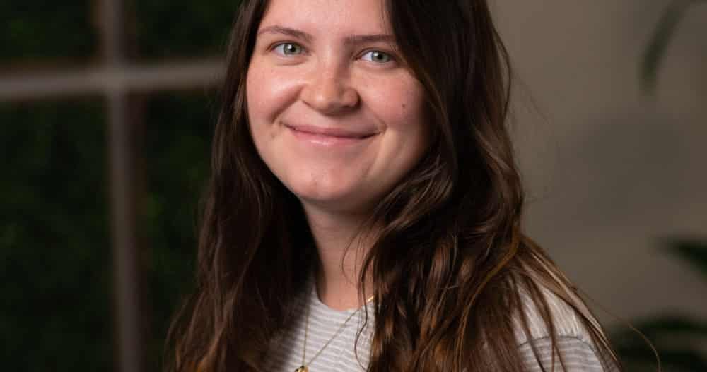 Headshot of Anita Malinskiy, Client Access Specialist, dressed in striped top.