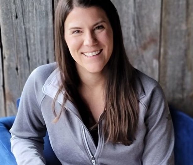 Headshot of Alexa Thelen, MA, LPCC, dressed in a gray zip-up sweater.