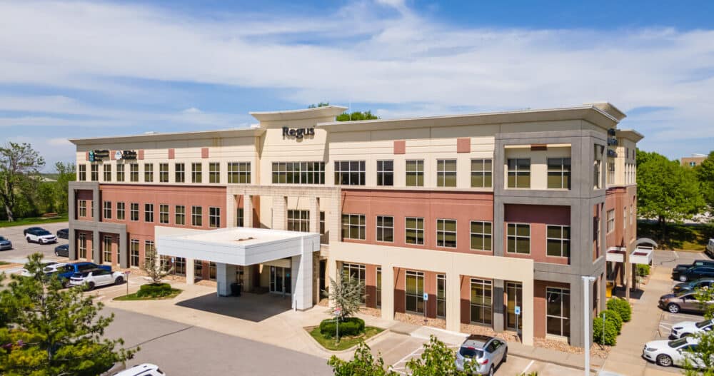 An exterior image of a commercial office building in Lee's Summit, Missouri. where an Ellie Mental Health Therapy Clinic is located.