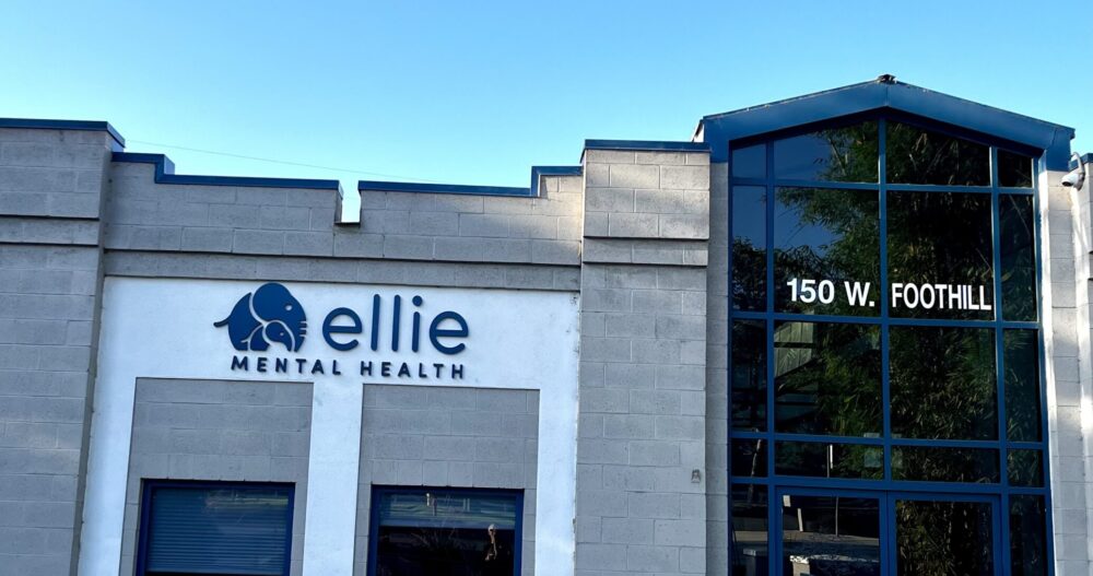 A gray brick building with an Ellie Mental Health sign for our San Dimas, CA Clinic