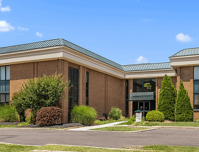 An exterior image of a commercial office building in Newton-Yeardley, Pennsylvania where an Ellie Mental Health Therapy Clinic is located.